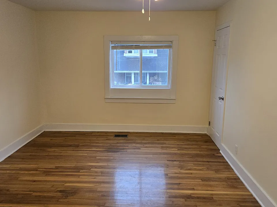 Livingroom, with ceiling fan, window view of the street.