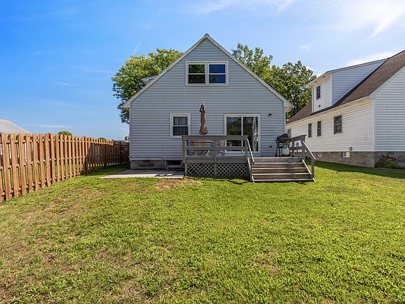 Back of house with deck