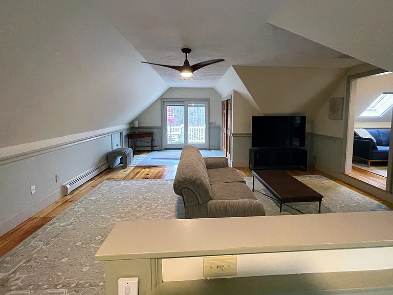 View from spare bed/office area of living room and main sliding door entry