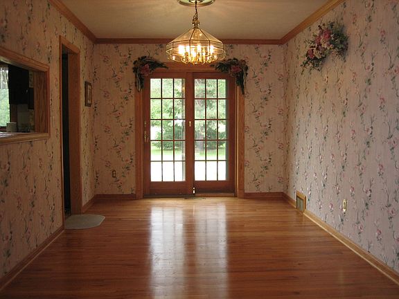 Dining Room with Hardwood Floors and View of Back Yard