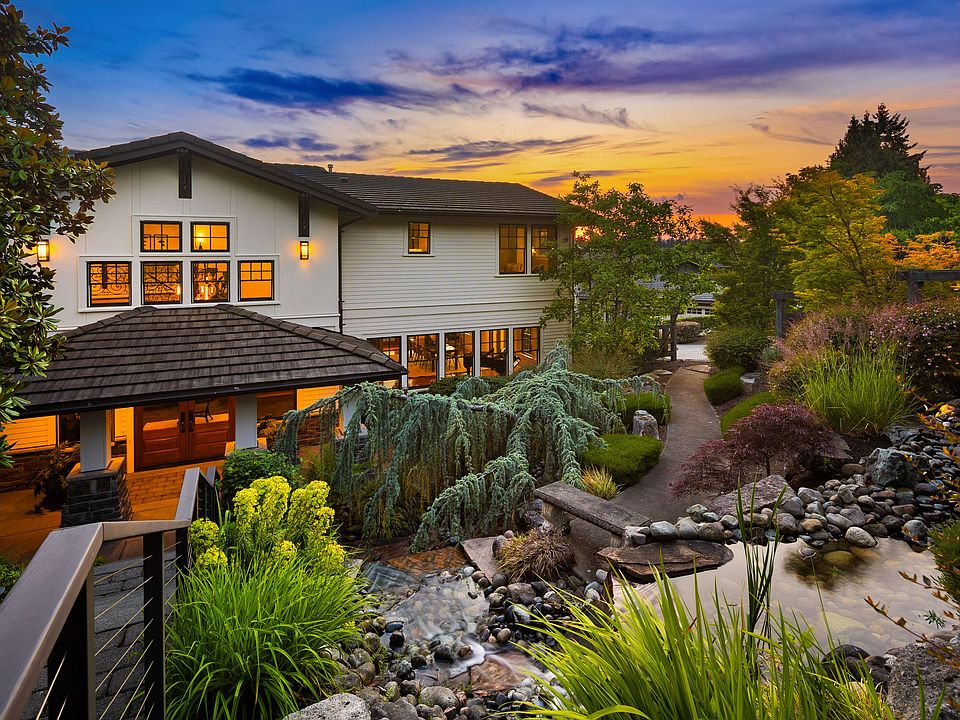 Stately and shimmering PNW Contemporary surrounded by nature and water views, offering privacy and luxury