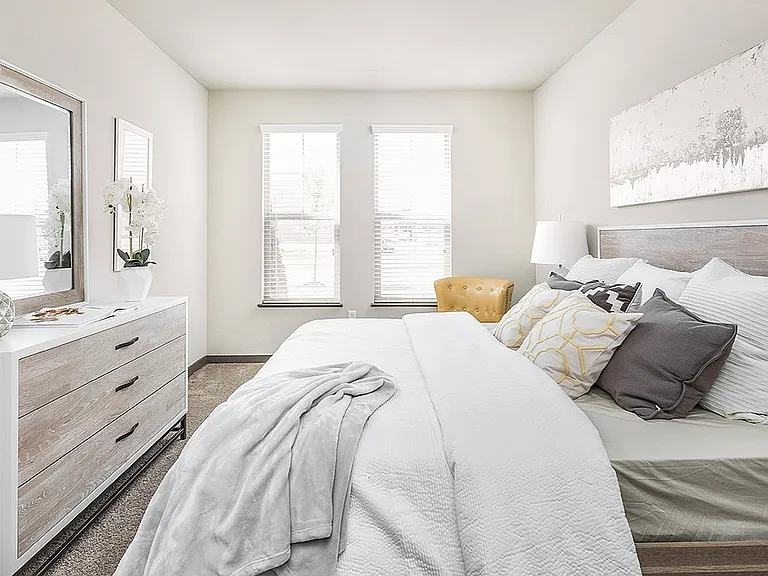 Sun-filled mornings, all day vibes. This bedroom brings in tons of natural light at The Flats in Fishers, Indiana.