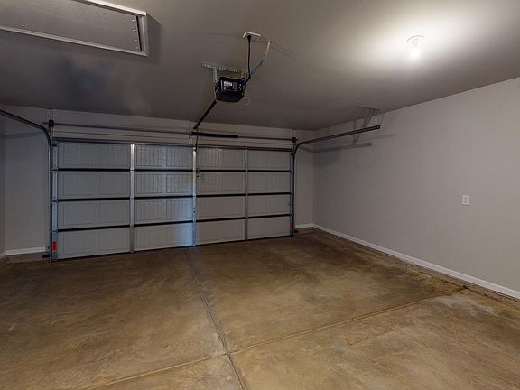 Empty Two Car Garage in Traditional Series 2382 from Hyde Homes