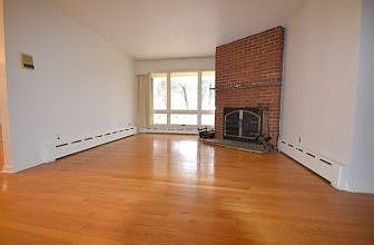 Living room with fireplace and hardwood floors