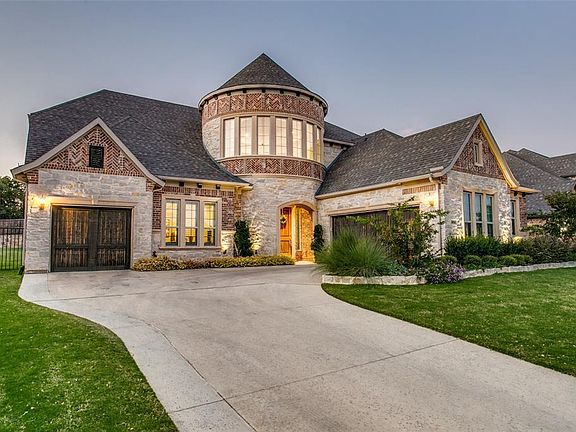 This Home Offer Three Car Garages, Lovely Landscaping, Gorgeous tone and Brick Facade