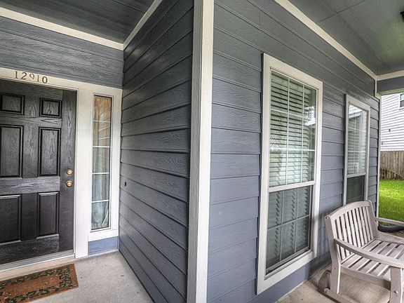 Newly tiled front porch is perfect for lazy summer afternoons with a cold glass of sweet lemonade.