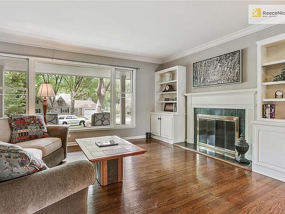 Built ins and a handsome fireplace.