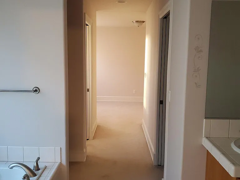 master suite hallway to baby/exercise room