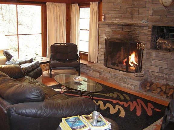 Living room with stone fireplace