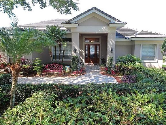 Front Exterior beautifully landscaped with a paver walkway