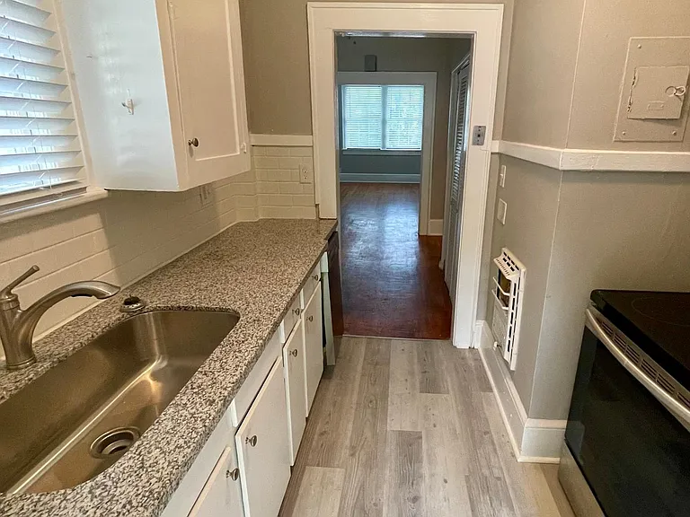 Newly renovated kitchen. Stainless steel appliances, granite countertops, farmhouse sink, dishwasher.
