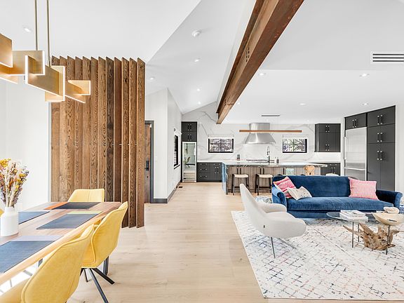 Open space living, dining and peek through to kitchen