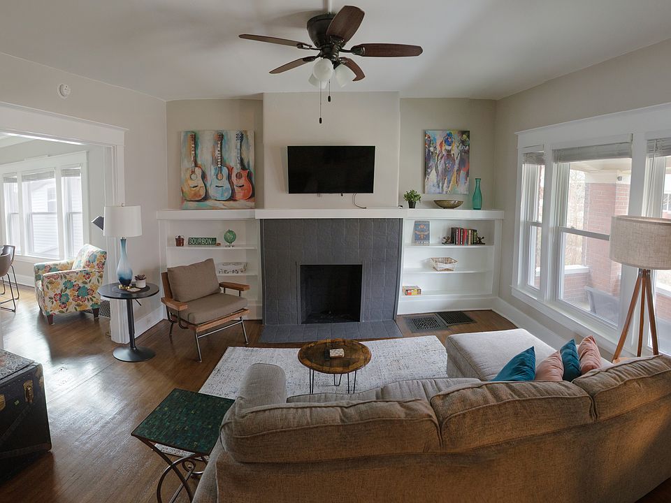 Smart TV and comfortable living room seating.
