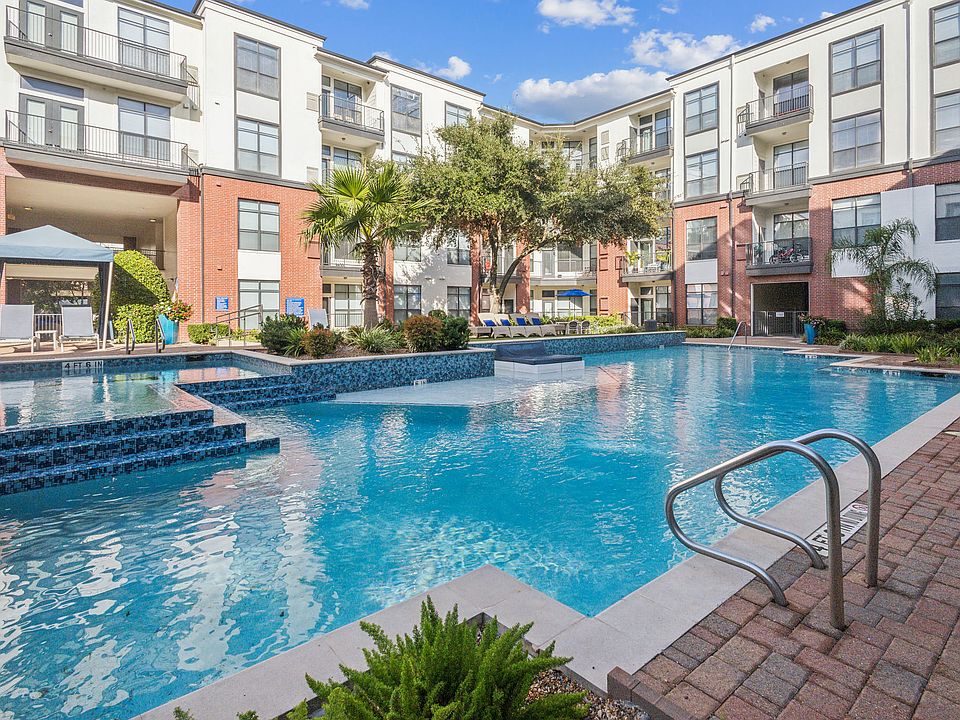 Resort-Inspired Pool with Sun Ledge, Lap Pool, and Waterfall