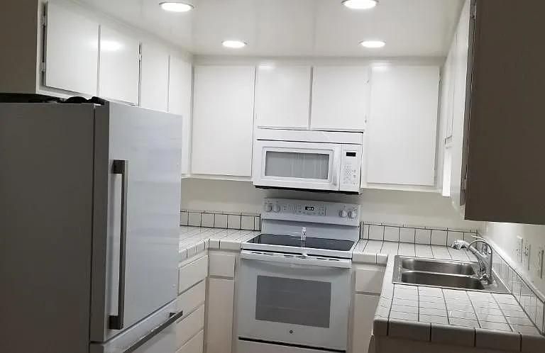 Newly remodeled Kitchen. New refrigerator, stove, lights, flooring, and fresh paint.