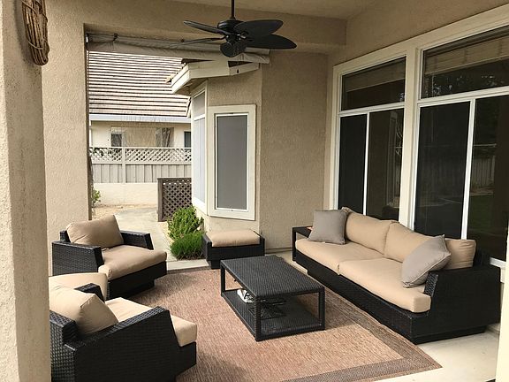 Comfortable patio with ceiling fan and furniture included.