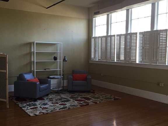 living room area with tall windows