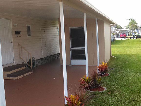 SIDE VIEW OF CARPORT/YARD