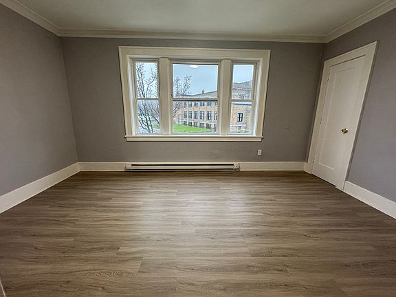 Large primary bedroom with full closet and street-facing views.