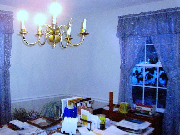Formal dining area with hardwood flooring