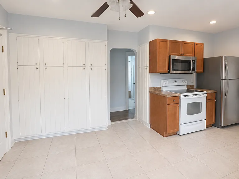 Additional built-in utility closet behind the counter