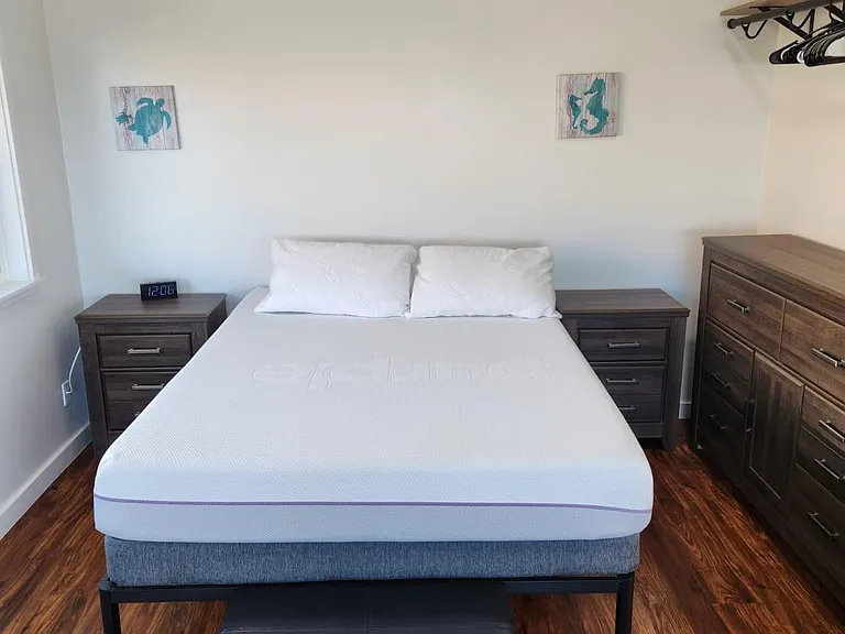 Queen sized Purple mattress. Dresser, nightstands and rods to hang clothes