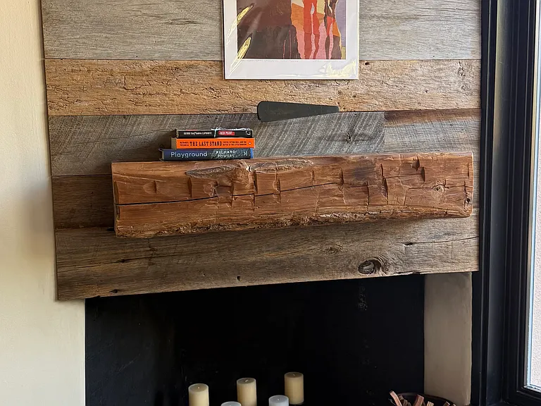 Custom fireplace and mantle with local art