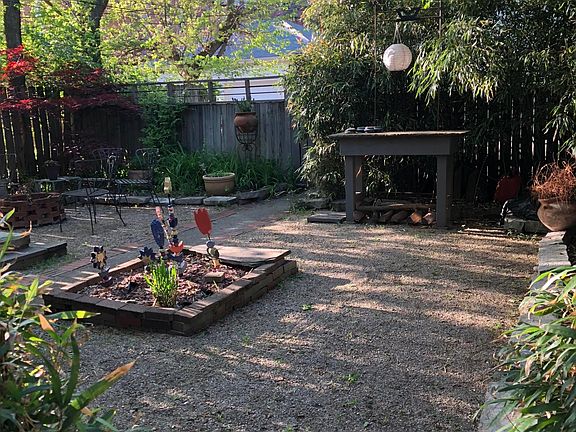 Rear courtyard as seen from apartment porch. An off-street p