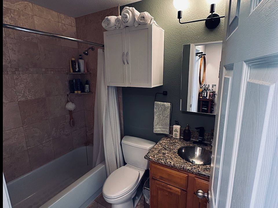 Clean, updated bathroom with full tub and shower
