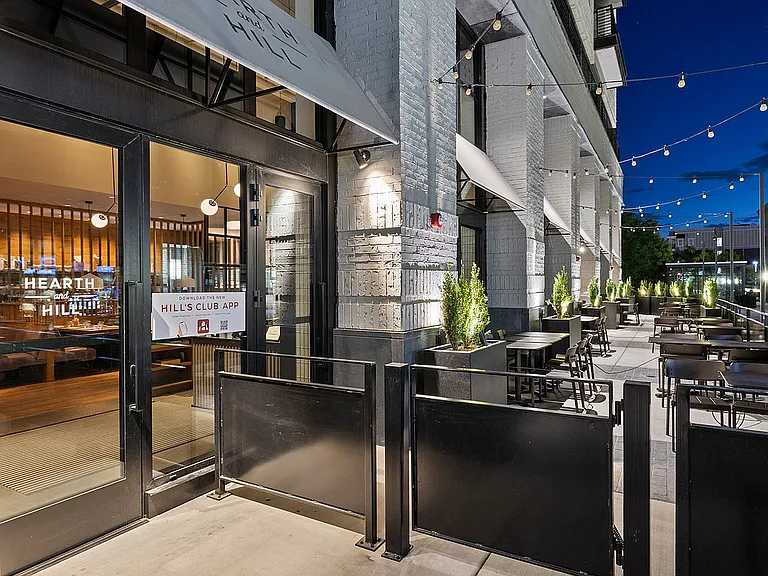 Street view of Hearth and Hill with patio seating