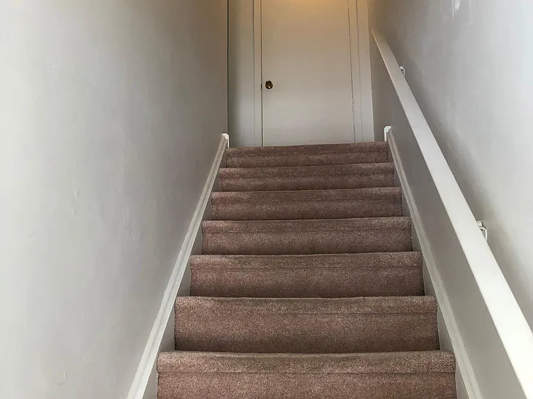Stairs from foyer to 2nd floor.