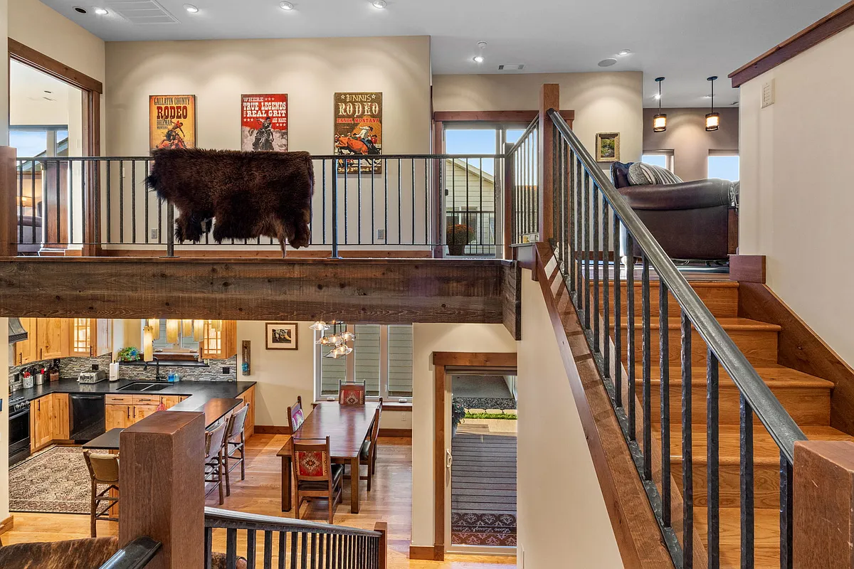 Open floor plan with extensive wood, iron and glass. - 1036 Oak Park Dr
