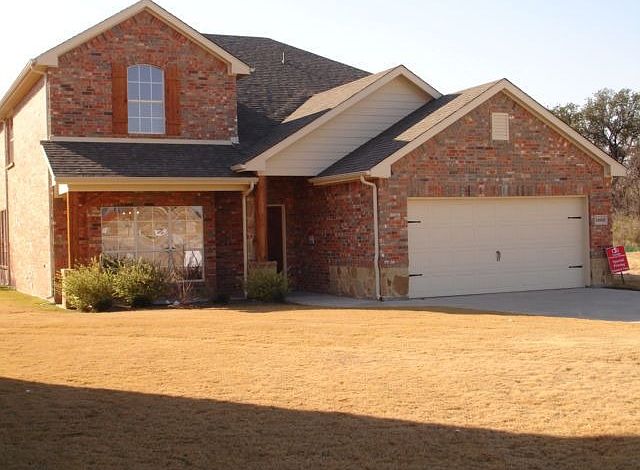 Brick and stone elevation with extened front porch