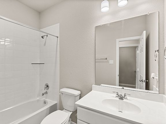 The secondary bath is perfectly situated off of the first floor bedroom perfect for visiting guests.