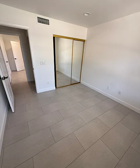 Front bedroom with mirror closet doors