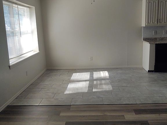 Dining with new tile and ceiling fan