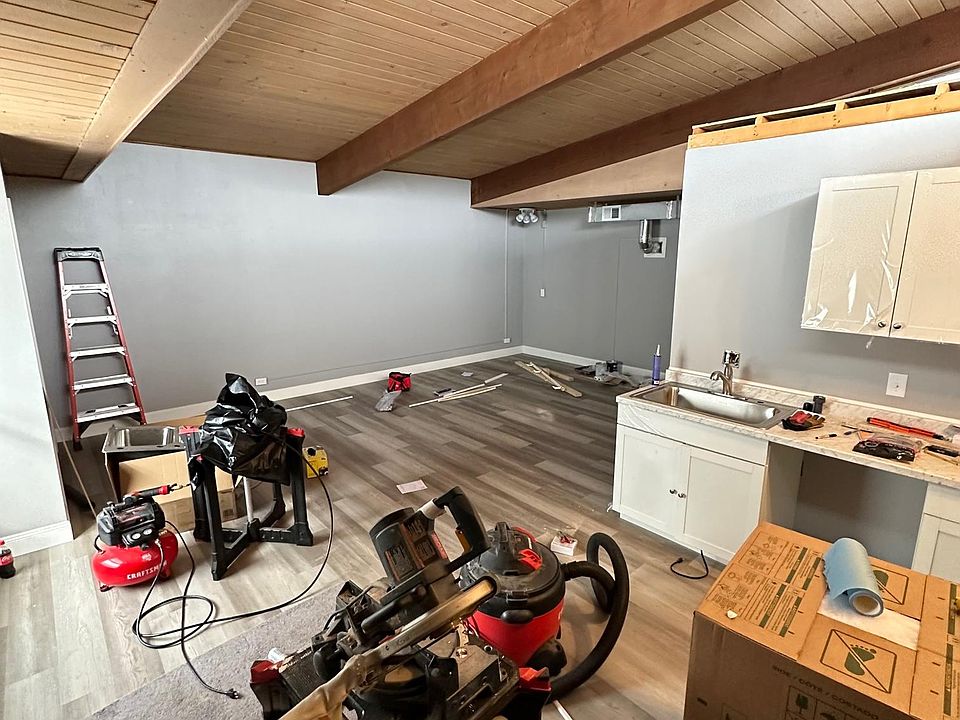 Really unique sloped ceiling with beautiful wood beams.