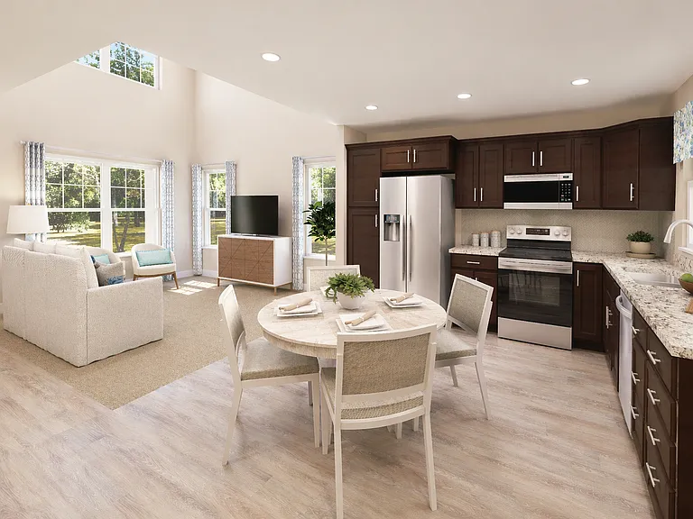 Airy kitchen and dining space featuring modern finishes, warm cabinetry, and plenty of room for gatherings.