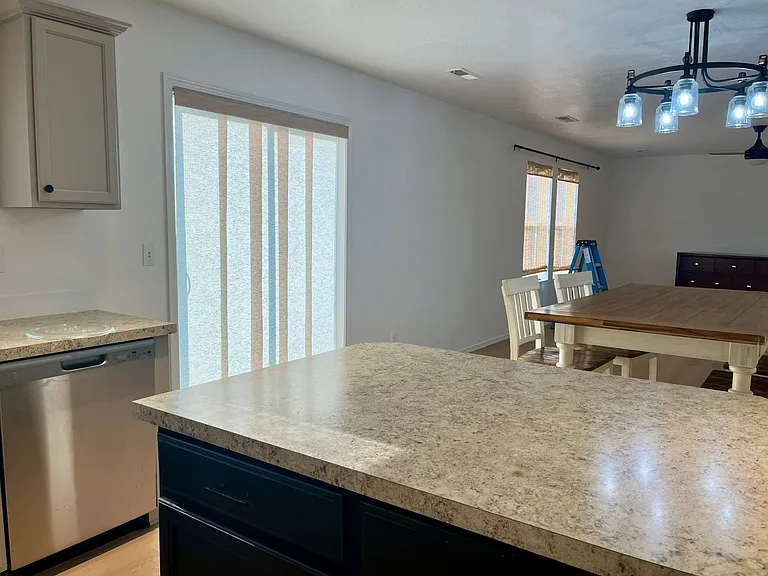 Kitchen looking into dining and living area