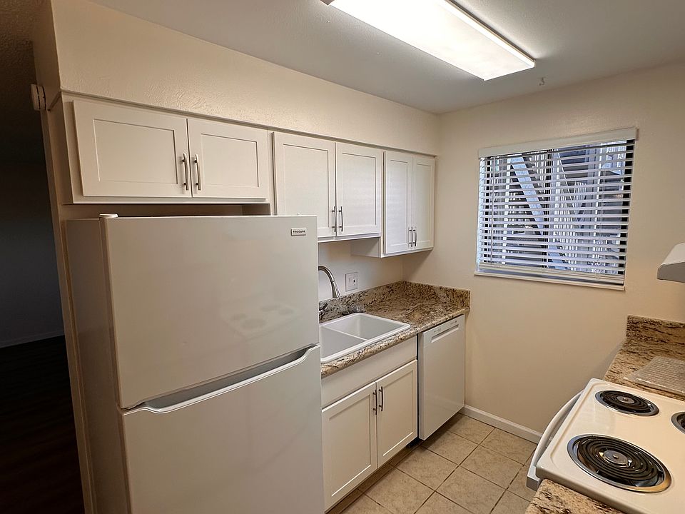 Kitchen with new cabinets, appliances, sinks, granite countertops, pulls, blinds, paint, switches and outlets.