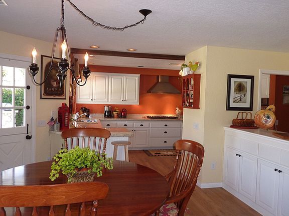 Dining area into kitchen with dutch door.