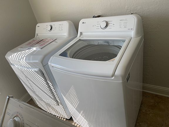 New washer and dryer in laundry room