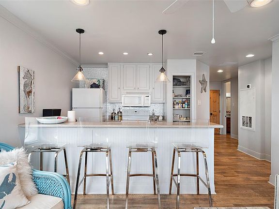 Modern kitchen with breakfast bar & pendant light fixtures