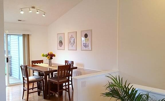 Vaulted ceilings in dining room and living room. Sliding door to private deck and storage.