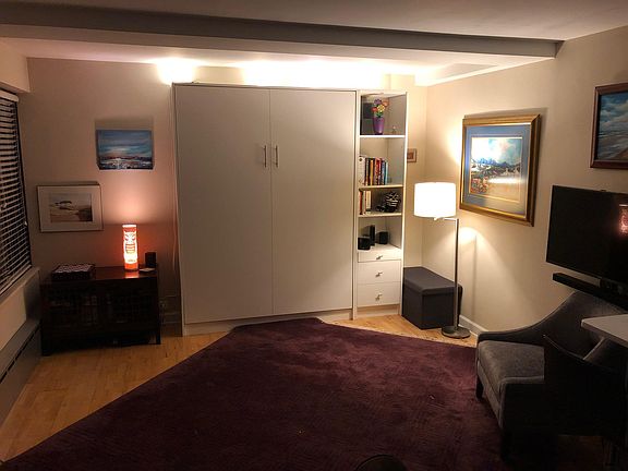 Built in Queen Murphy wall bed with shelving - closed