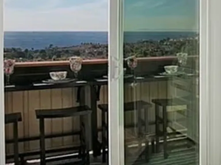 Steps from kitchen to dining on private balcony.