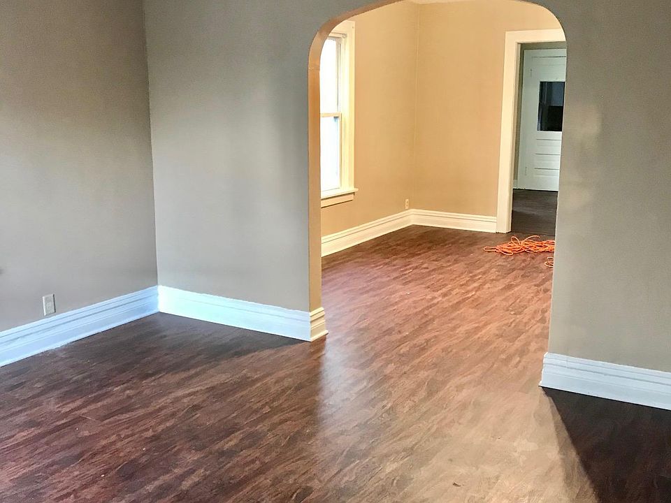 Very large living room with lots of natural lighting.