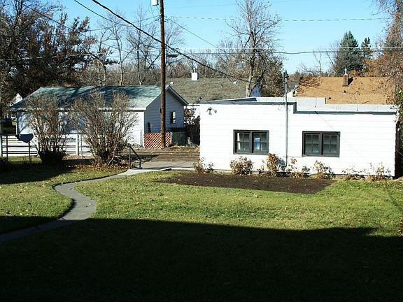 Big back yard with 15 roses bushes and garden