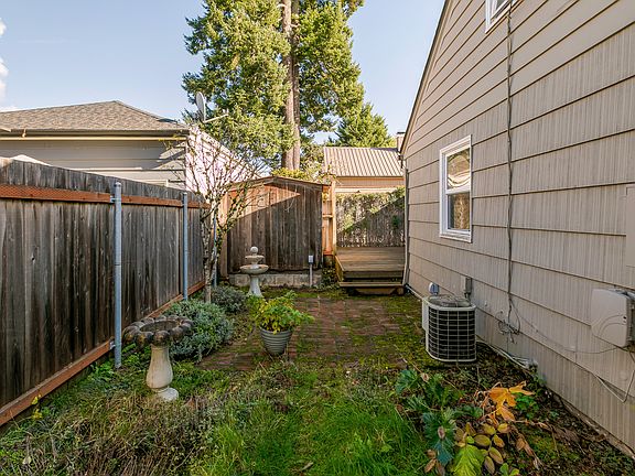 Fenced side yard with garden area