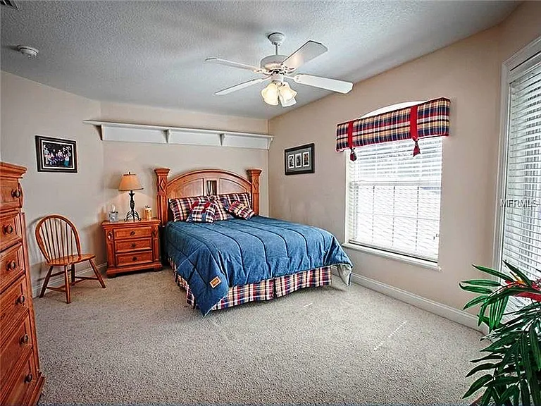 This is one of two upstairs bedrooms which are connected by a jack n jill bath and they each open out on an upper deck overlooking the lake with spectacular views. there are also craft rooms attached to the upper BRs.